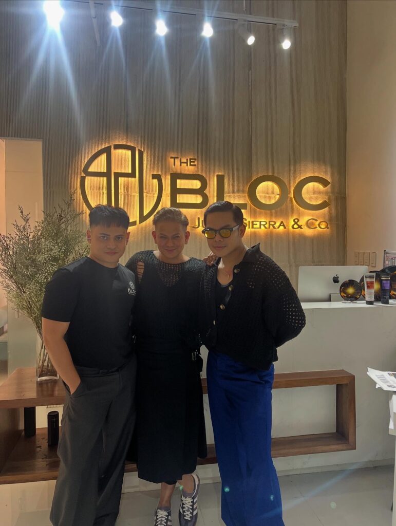 The BLOC salon entrance with its illuminated gold logo