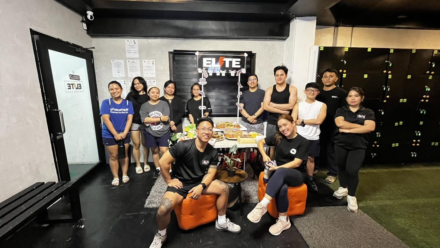 The ELITE Fitness team and members inside the gym