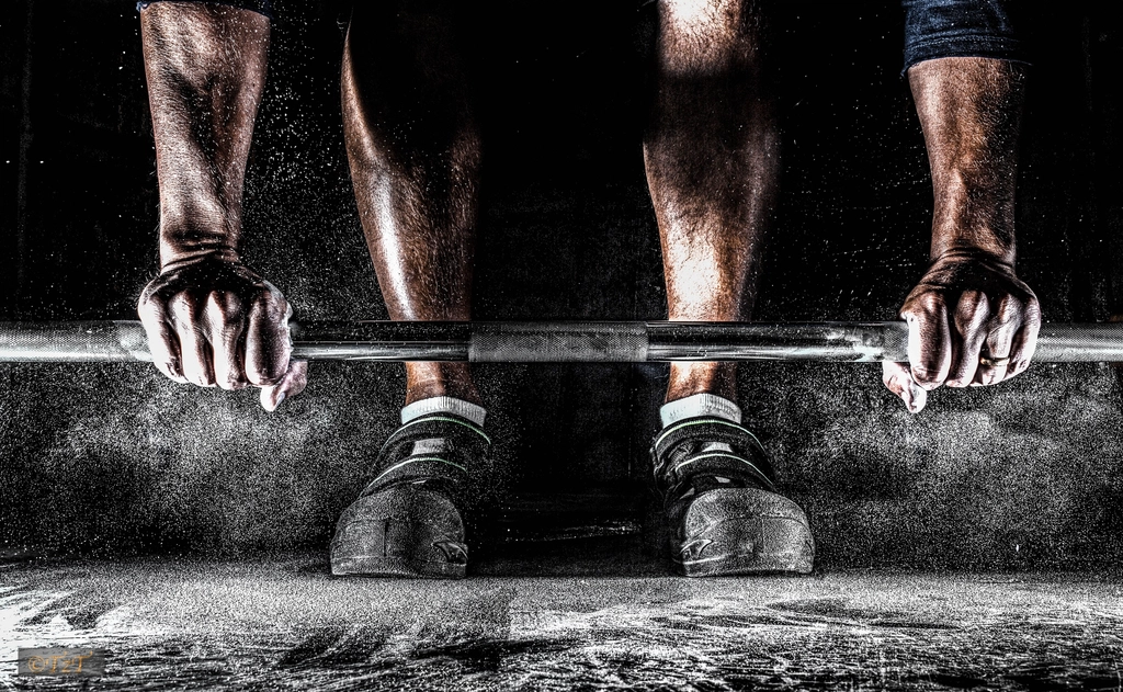 Lifting a barbell in the gym